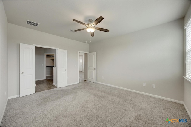 unfurnished bedroom with carpet and ceiling fan