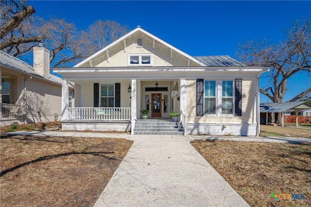 bungalow-style house featuring covered porch