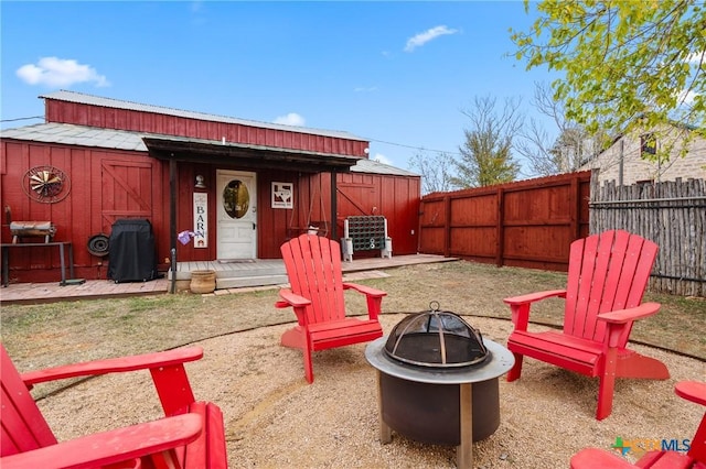 exterior space featuring an outdoor fire pit