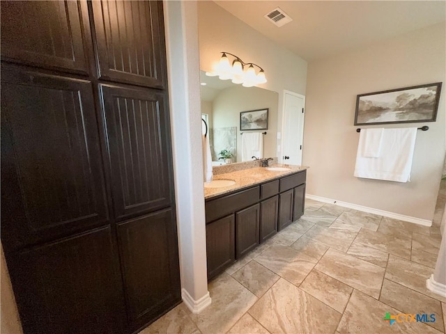 416 Coventry Dr, Temple, TX 76502 - full bath featuring double vanity, baseboards, and marble finish floors