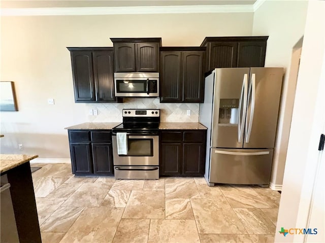 416 Coventry Dr, Temple, TX 76502 - kitchen with appliances with stainless steel finishes, crown molding, light stone countertops, baseboards, and tasteful backsplash