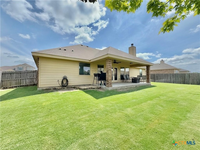 416 Coventry Dr, Temple, TX 76502 - rear view of house featuring a ceiling fan, a patio area, and a chimney