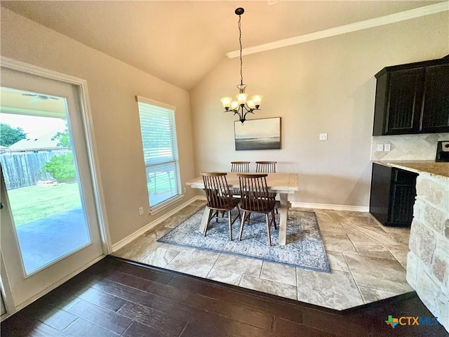 416 Coventry Dr, Temple, TX 76502 - dining room featuring vaulted ceiling, a chandelier, and baseboards