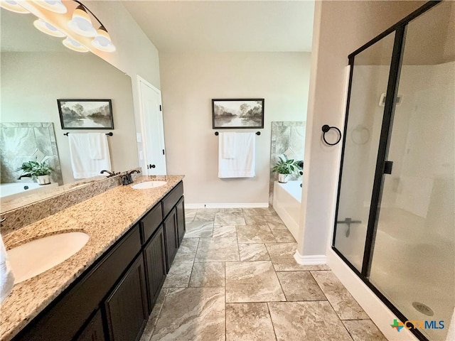 416 Coventry Dr, Temple, TX 76502 - bathroom featuring a bath, baseboards, a shower stall, and double vanity