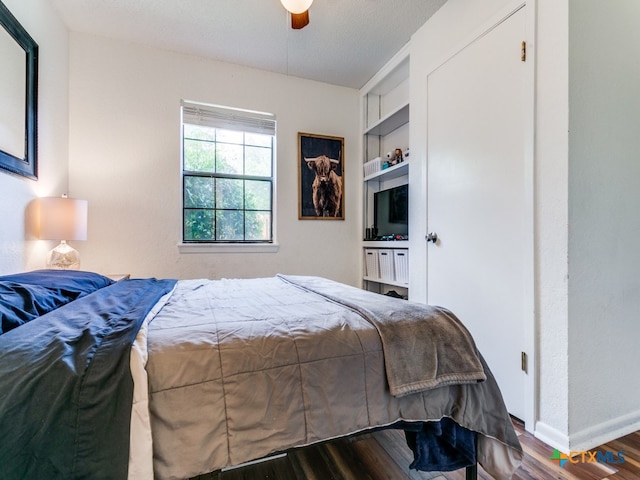 bedroom featuring wood-type flooring and ceiling fan