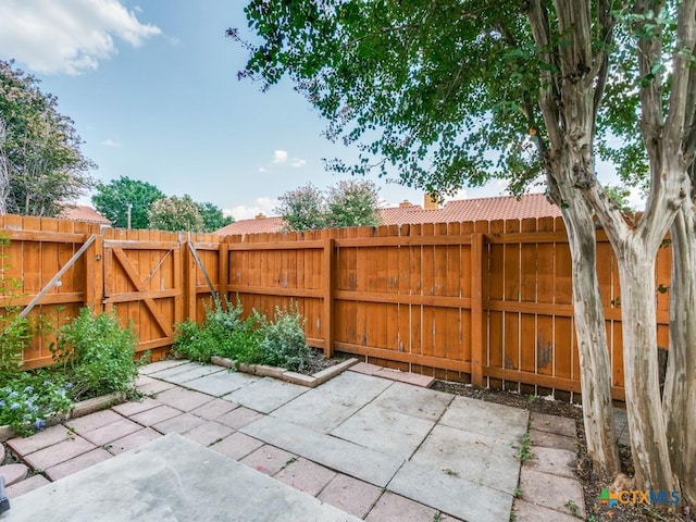 1133 Ashby St, Seguin, TX 78155 - view of patio / terrace with a fenced backyard and a gate