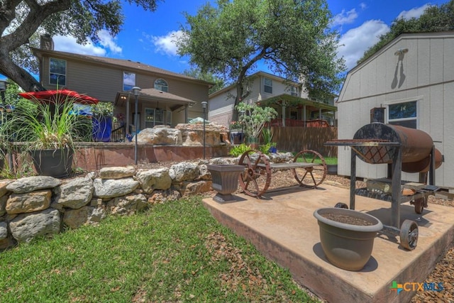 view of yard with a patio and fence