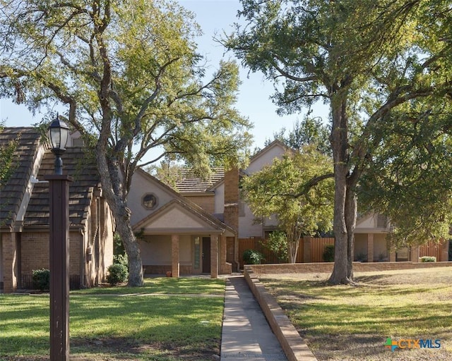 view of front of house with a front lawn