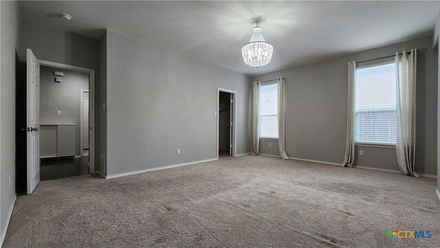 9012 Lonesome Oak Dr, Temple, TX 76502 - unfurnished bedroom featuring a chandelier, carpet floors, and baseboards