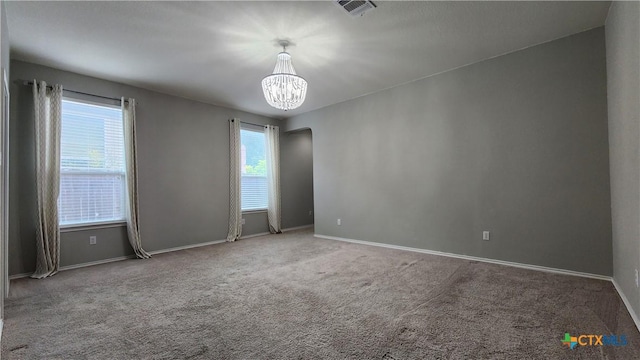 9012 Lonesome Oak Dr, Temple, TX 76502 - unfurnished room with arched walkways, carpet, a chandelier, and baseboards