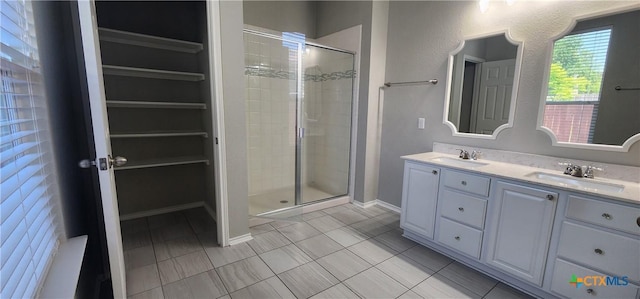 9012 Lonesome Oak Dr, Temple, TX 76502 - bathroom featuring a stall shower, tile patterned floors, double vanity, and baseboards