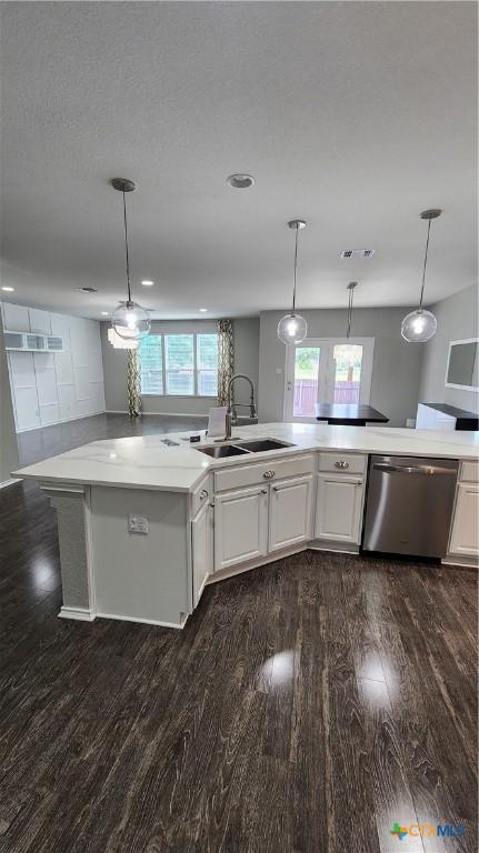 9012 Lonesome Oak Dr, Temple, TX 76502 - kitchen featuring dishwasher, a sink, dark wood-style floors, and light countertops