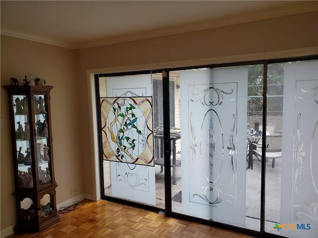 doorway featuring light parquet floors and ornamental molding