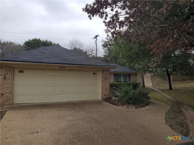 single story home featuring a garage