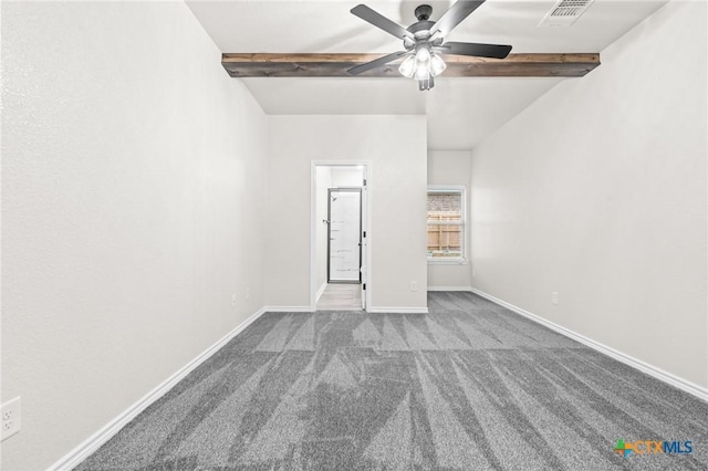 carpeted empty room featuring ceiling fan and lofted ceiling with beams