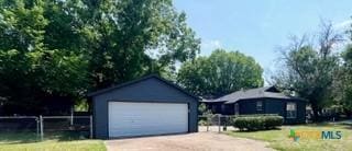 3524 Swan St, Fort Worth, TX 76117 - view of front of home featuring driveway and a garage