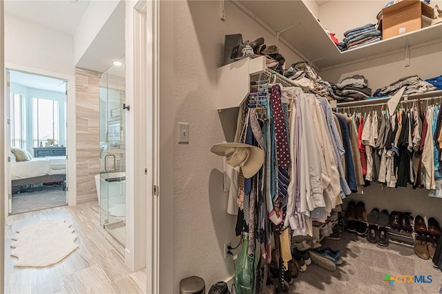 walk in closet featuring light wood-type flooring