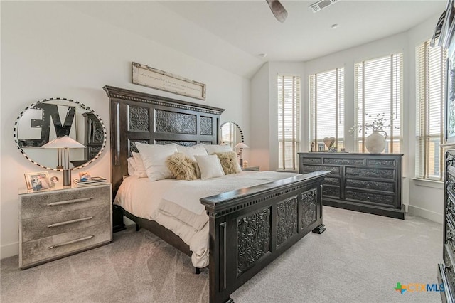 carpeted bedroom featuring ceiling fan and vaulted ceiling