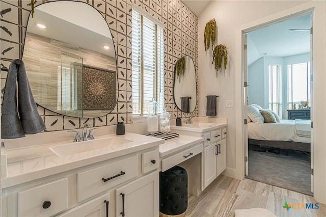 bathroom with vanity and an enclosed shower