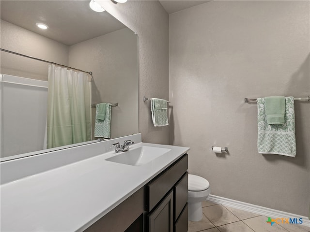 bathroom with tile patterned flooring, vanity, toilet, and a shower with shower curtain