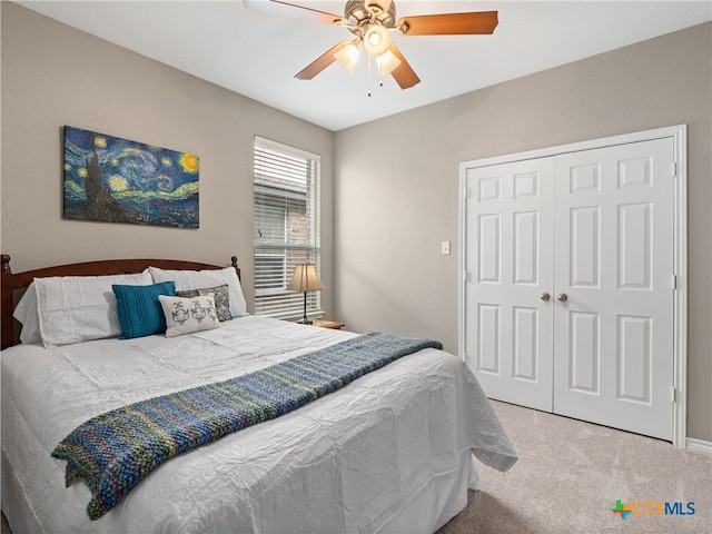 bedroom with carpet floors, a closet, and ceiling fan