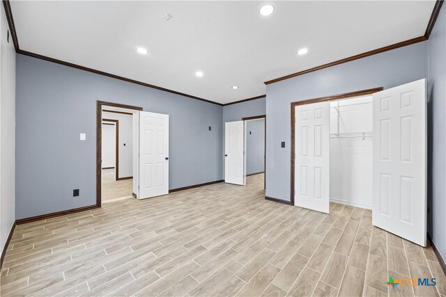 unfurnished bedroom with a closet, light hardwood / wood-style flooring, and ornamental molding