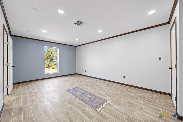 unfurnished room with light hardwood / wood-style flooring and ornamental molding