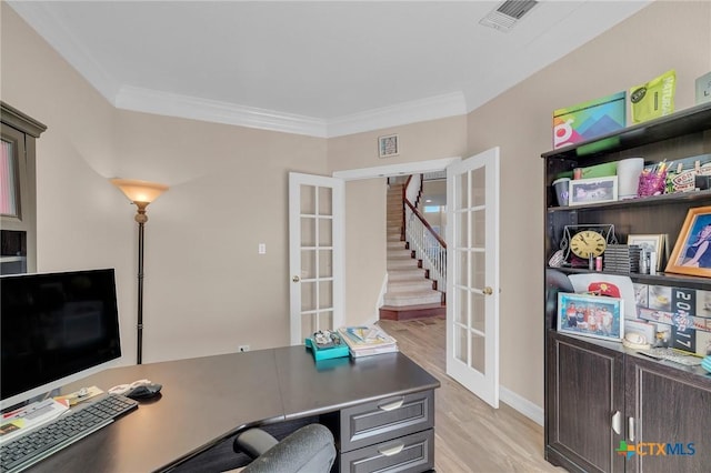 home office featuring crown molding, french doors, visible vents, and light wood-type flooring