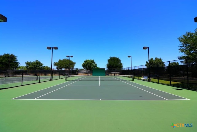 view of sport court with community basketball court and fence