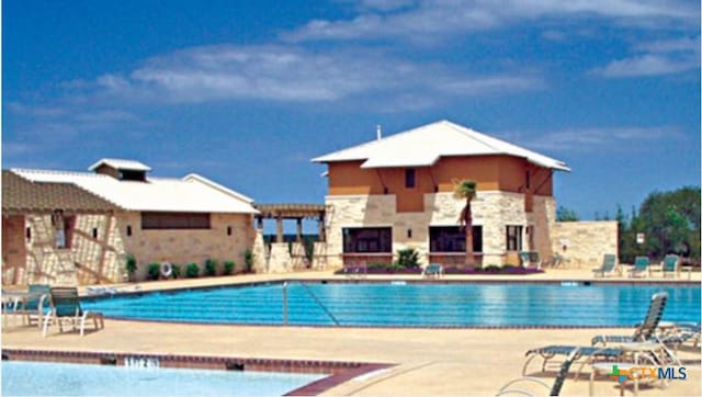 pool featuring a patio area