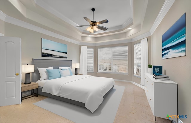 bedroom with a raised ceiling, crown molding, baseboards, and ceiling fan