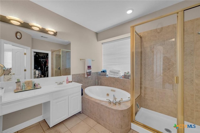 bathroom featuring vanity, visible vents, a stall shower, a whirlpool tub, and tile patterned flooring