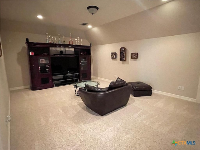 home theater featuring baseboards, lofted ceiling, and carpet flooring