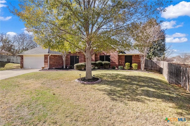 view of front facade with a garage and a front yard