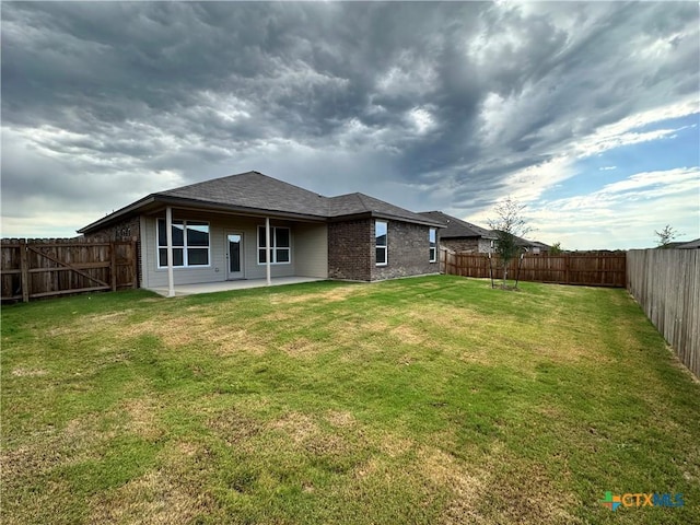 3104 Gryffindor Ln, Killeen, TX 76549 - rear view of house with a patio area, brick siding, and a shingled roof