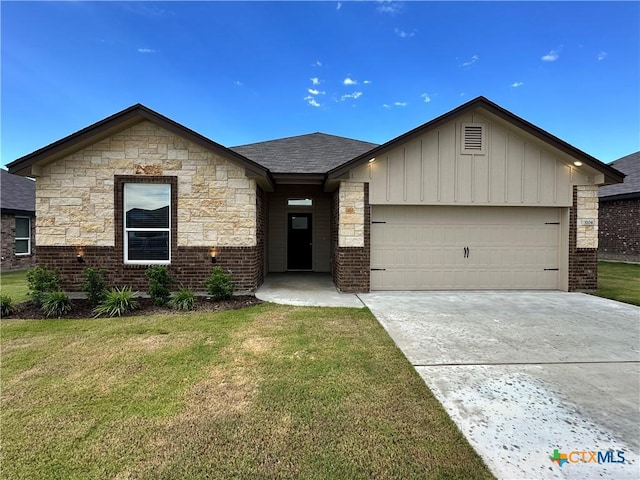 3104 Gryffindor Ln, Killeen, TX 76549 - view of front of house with a garage, a front lawn, driveway, brick siding, and board and batten siding
