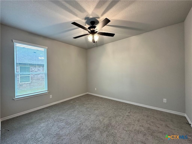 3104 Gryffindor Ln, Killeen, TX 76549 - spare room featuring dark carpet, a ceiling fan, and baseboards