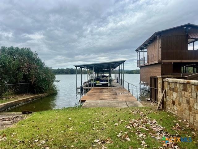 dock area featuring a water view