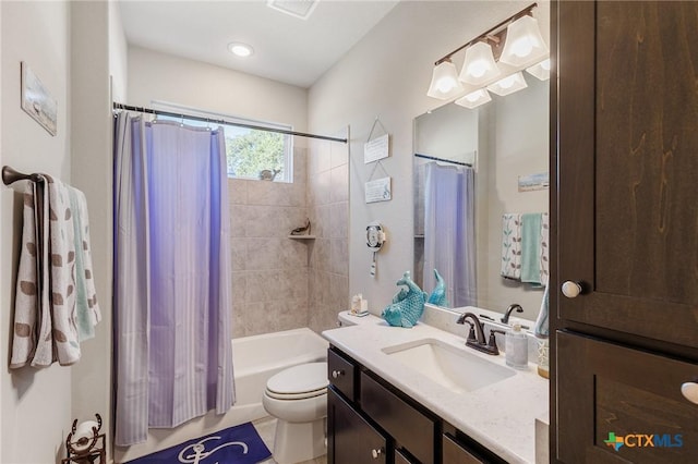 full bathroom with tile patterned floors, vanity, toilet, and shower / tub combo