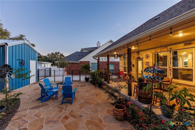 view of patio terrace at dusk