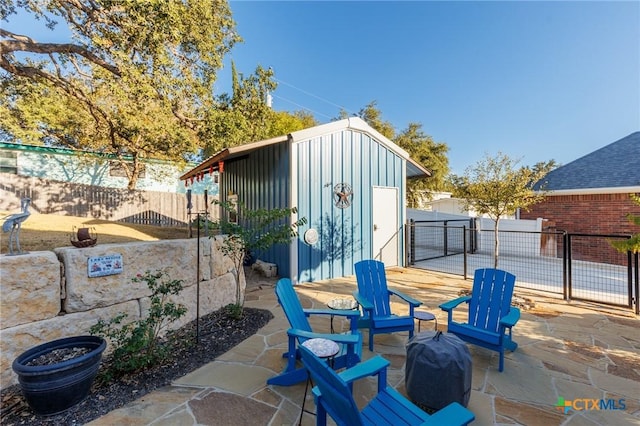 view of patio with a storage unit