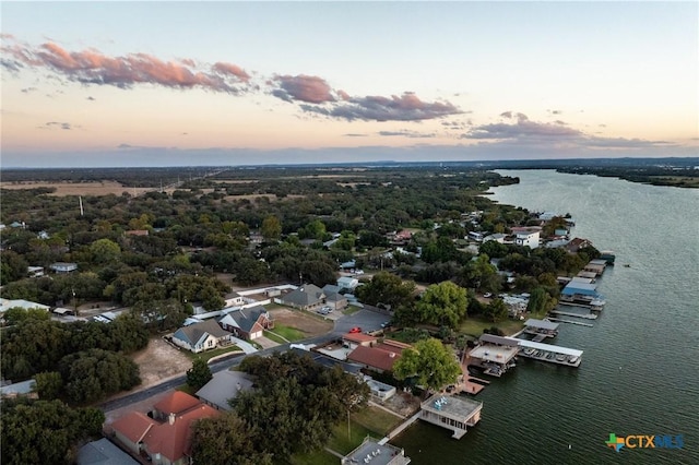 aerial view at dusk with a water view