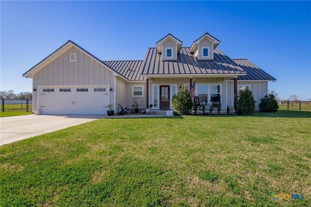 modern farmhouse with metal roof, board and batten siding, an attached garage, and a standing seam roof