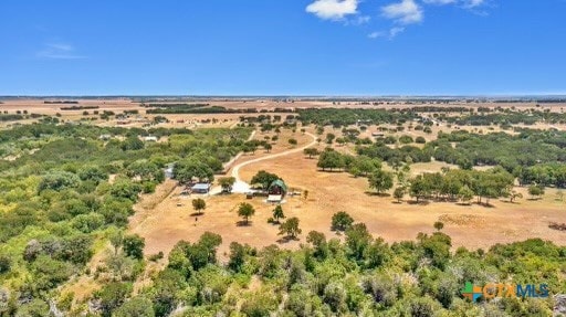 birds eye view of property with a rural view