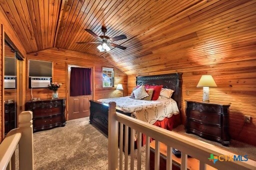 bedroom with carpet flooring, wood walls, lofted ceiling, wooden ceiling, and ceiling fan