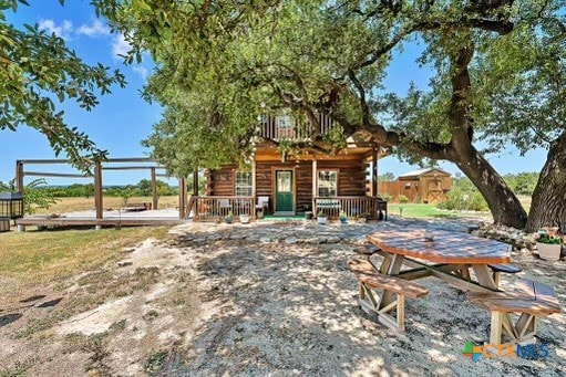 view of yard featuring a wooden deck