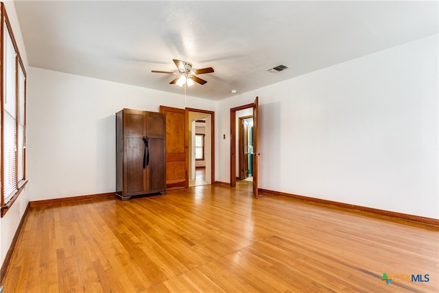 spare room featuring ceiling fan and light hardwood / wood-style flooring