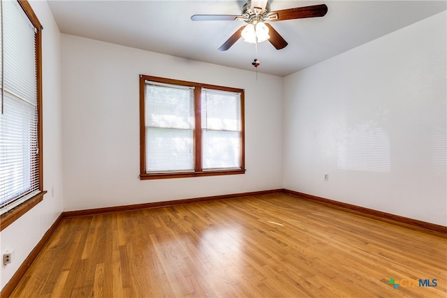 spare room with ceiling fan and light hardwood / wood-style flooring