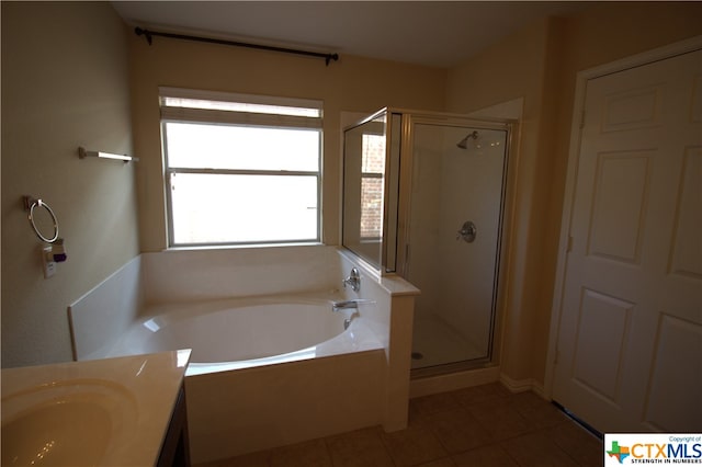 bathroom with vanity, independent shower and bath, and tile patterned flooring