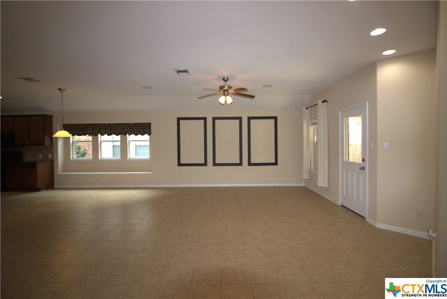2005 Granite Springs Rd, Leander, TX 78641 - unfurnished living room featuring ceiling fan, recessed lighting, and baseboards